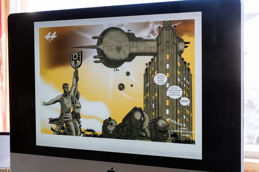 Sarjakuvapiirros tietokoneen ruudulla.