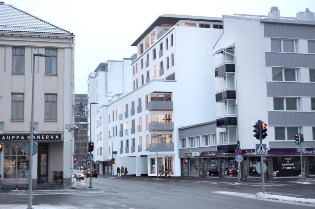 Havainnekuva kerrostalosta ja katunäkymästä.
